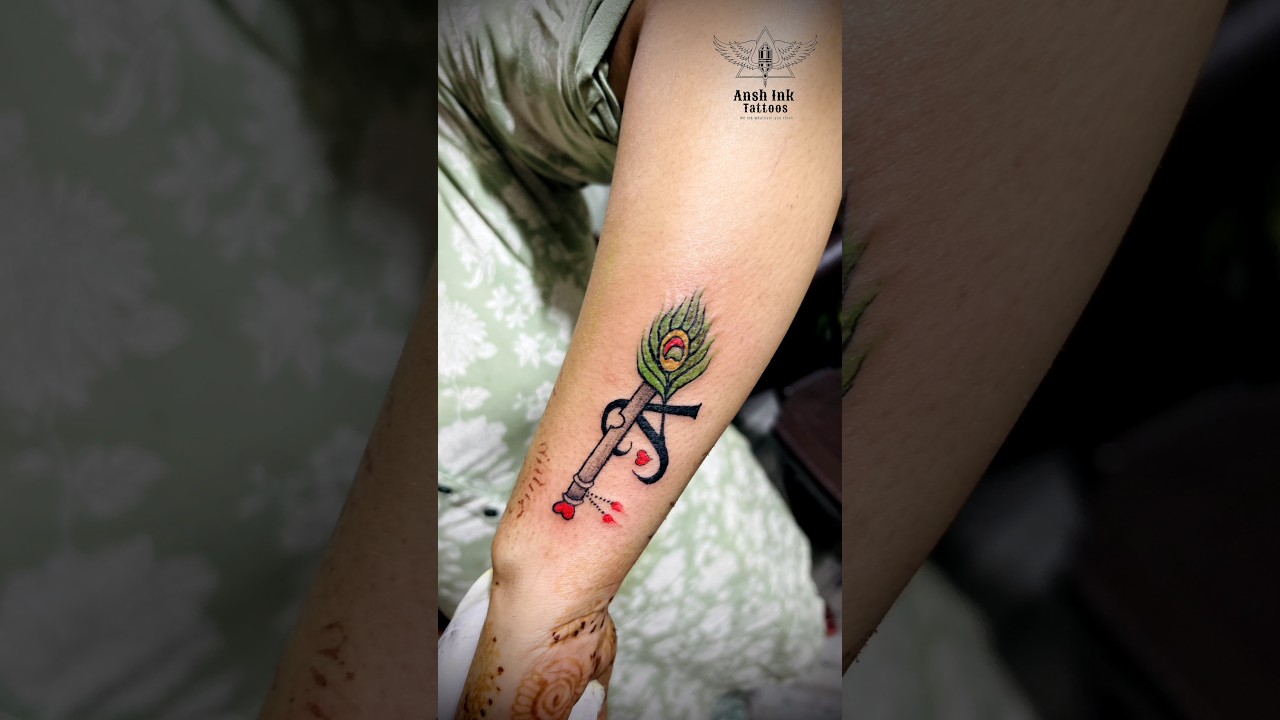 Feather Tattoo | Flute Tattoo | Letter Tattoo | Small Heart Tattoo | Wrist Tattoo