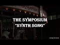 The Symposium - Synth Song |Lyrics y traducción|