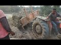 Mahindra tractor machine soil transport delivery by powerful engine performance working the soil.