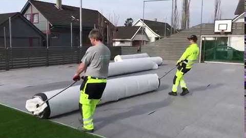 Moving a roll of artificial grass with Henko Pull Bars