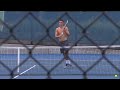 Bernard Tomic warms up