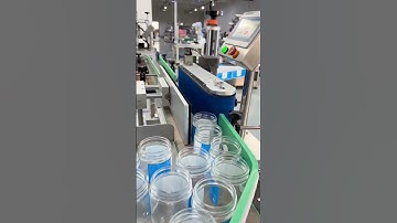 Glass bottle jar adhesive label rolling labeling machine automatic labeling video