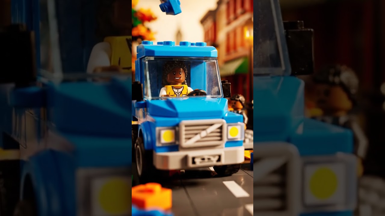 A cinematic LEGO style miniature city street in warm autumn light  shallow depth of field  colorful