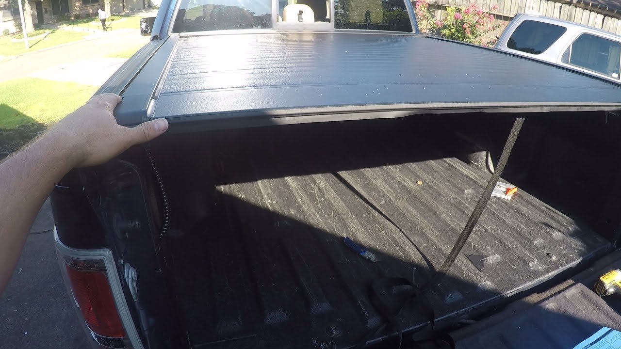Ford F150 Bed Cover that is compatible with a removable ladder rack