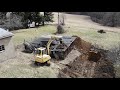 Tearing down a Barn with an Excavator