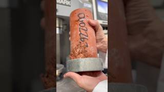 Checking the early compressive strength of a colored high-strength concrete mix.