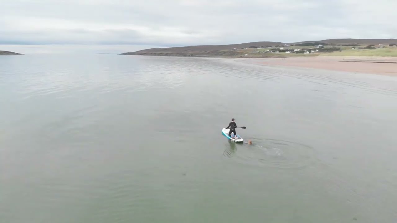Paddleboarding in Scotland from Big sands beach near Gairloch Drone footage from Western Scotland.