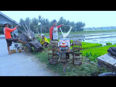 Tractors Changing Wheel Hand Crank Walking Down the Field and Working Tilling Leveling Mud
