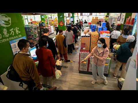 Panic buying grips Beijing supermarket after lockdown rumours