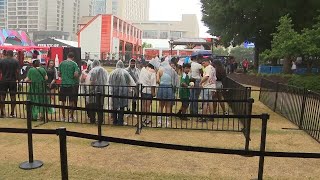 Weather shifts FIFA Fan Festival schedule, but fans still line up for coveted 'Fan Bands'