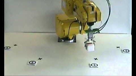 Shared Control Architecture Based on RFID to Control a Robot Arm Using a Spontaneous BMI