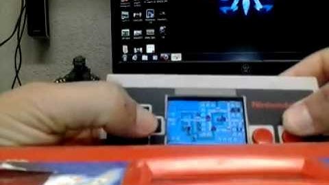 GBA Micro MOD inside NES controller by:The WiZ