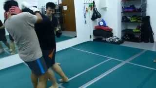 Muay Thai kickboxing sparring with multiple opponents