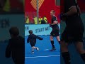 Scott Boyde plays with his son on the World Cup pitch post match.