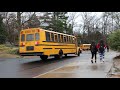 Some of the 29 school buses departing Greenwich High School