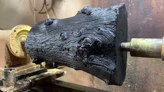 How an ancient woodworking master carved a burnt log into a one of a kind piece on a wood lathe