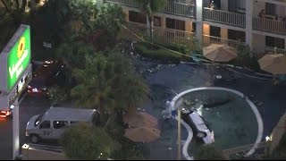 SUV IN POOL:  Raw video of SUV crash into pool at Los Angeles Motel