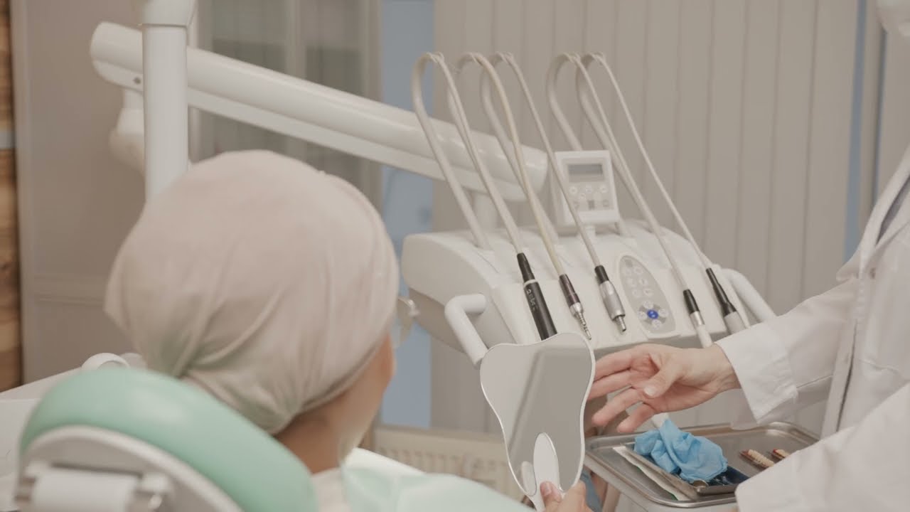 patient looking in mirror after dental treatment, Free Stock Video without Watermark | No copyright