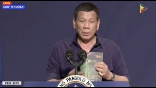 dutertes meeting with filipinos in korea sealed with a kiss