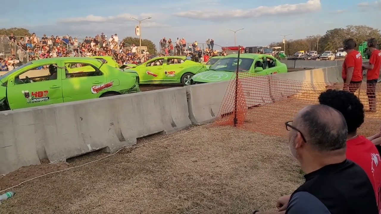 Destruction derby parts go flying  tires come off 