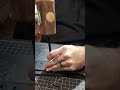 Punching holes in a guitar strap. #customleather #leathercraft #handmade #guitarstrap