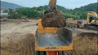 excavator loading dumptruck Fuso FS100