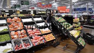 Long shot, customers shop inside a Walmart Supercenter st...