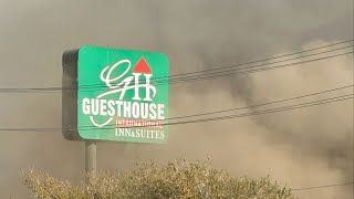 Suspect arrested for arson following Guesthouse International Inn and Suites fire