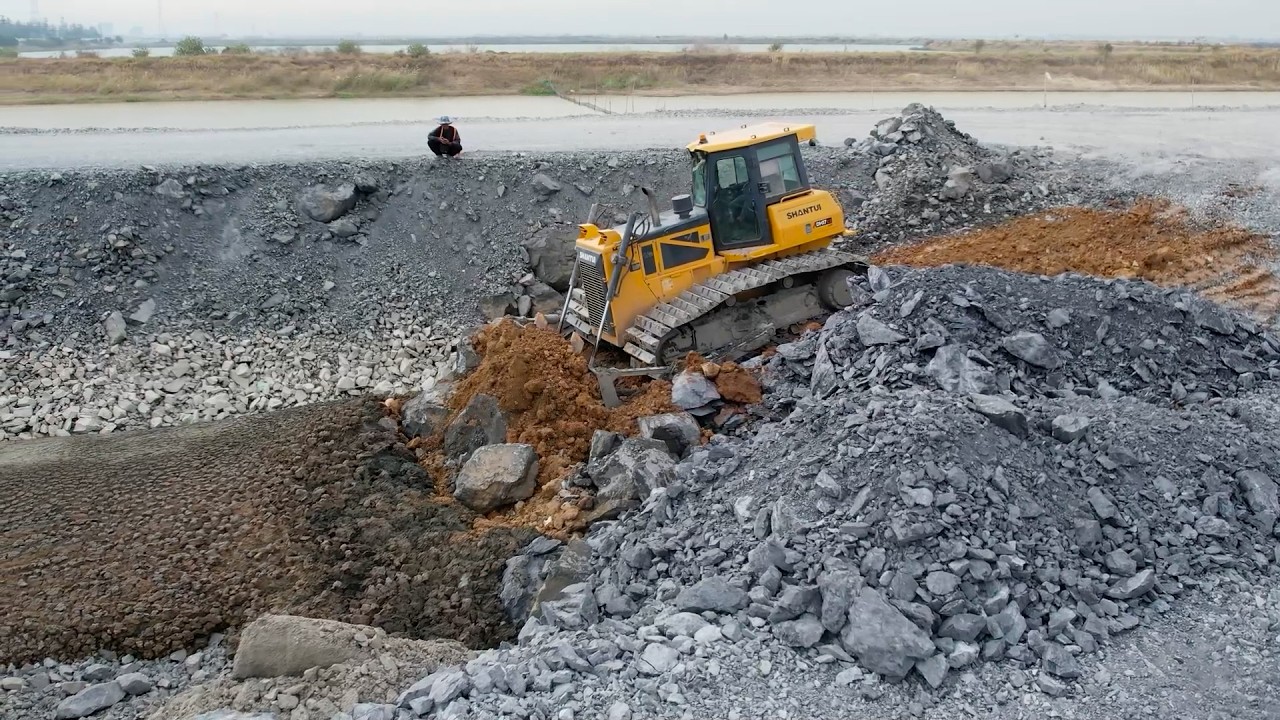 Urgent Working!! Process Bulldozer Push Stone and Dump Truck Unloading Stone into Huge Lake