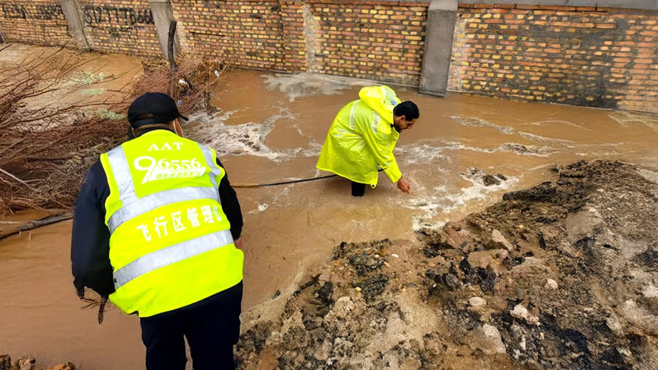 Draining A Flooded Street Flood Fix Pros Unclogging Massive Drains ...