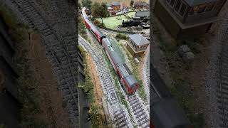 DVT 82229 passes the stream being pushed by a Class 67. Transport for Wales livery.