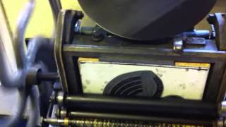 Footage of a vintage (100 year old) printing press in Malmesbury.