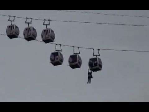 Jonathan Goodwin hanging from a cable car - YouTube