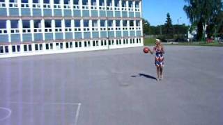 Stella Mwangi playing basketball