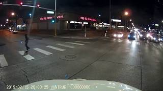 Pedestrian walks in front of traffic