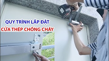 Cận cảnh quy trình lắp đặt thực tế cửa thép chống cháy bản lề mở tay co đẩy hơi thủy lực SaigonDoor