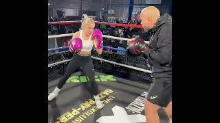 Astrid Wett hitting pads at the Prime Card open workout
