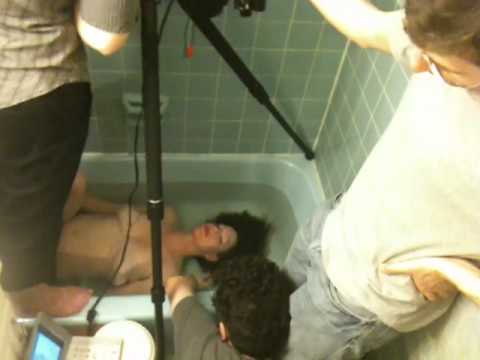 amanda palmer getting filmed in a bathtub for the "No Surprises" radiohead ukulele video