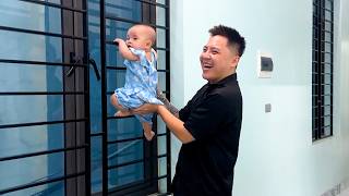 IIt looks so funny watching Dad help Baby Kim climb the window
