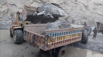 Hard Work with Hard Rocks: Caterpillar 966F Loading Trolleys