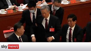 China's former president unexpectedly escorted out of party congress