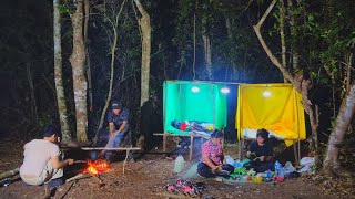 Camping and building an overnight shelter in the middle of the forest.