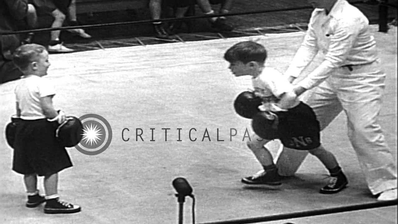 Two young boxers fight in a boxing ring and they display pep and punch while boxi...HD Stock Footage