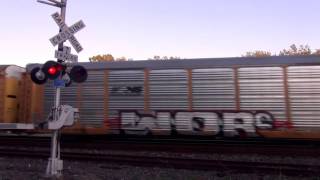 Fast CSX Auto Rack Train at RR Crossing