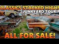 Old classic cars  trucks for days stacked 3 cars high dont miss this junkyard tour all for sale