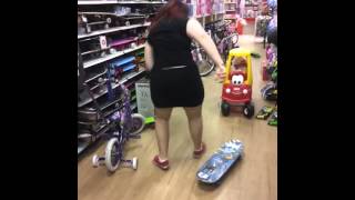 Girl falls off skate board.