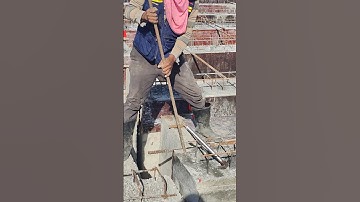 Workers used a deform bar to remove beam formwork