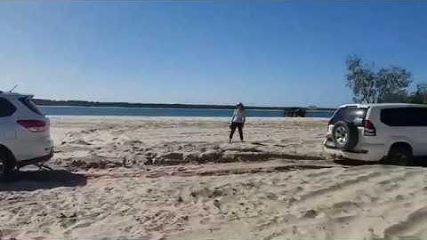 Hire car gets bogged at beach tried to use towball for snatching