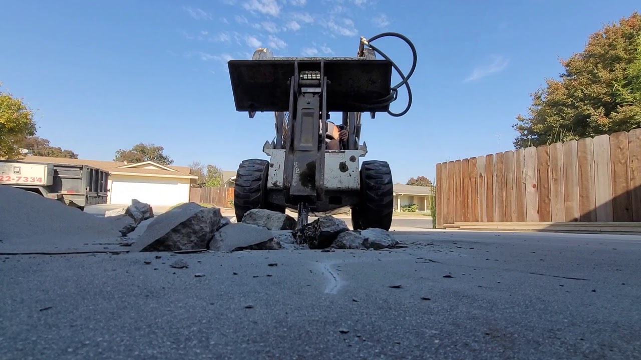 Skid steer breaking concrete YouTube