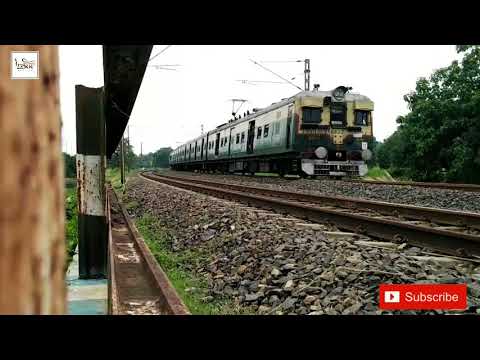 Howrah - katwa Galloping  local passing a huge curving railgate